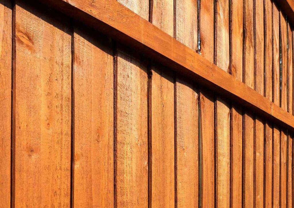 Wooden Garden Fence Close Up With Vertical Panels And Horizontal