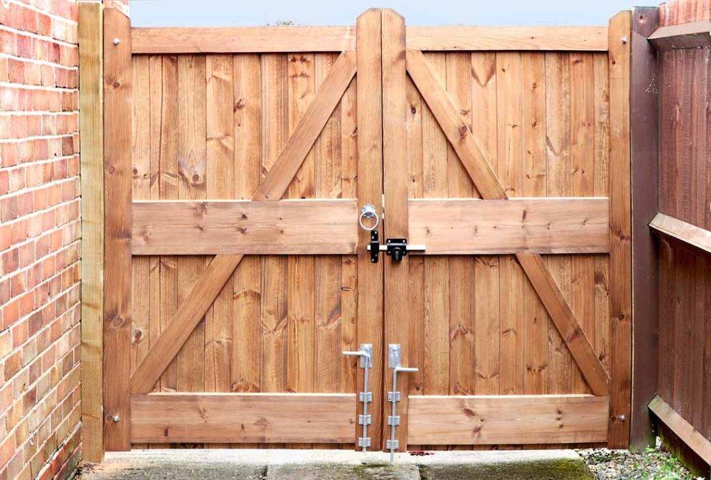Double Wooden Gates With Metal Handle And Lock Bolt